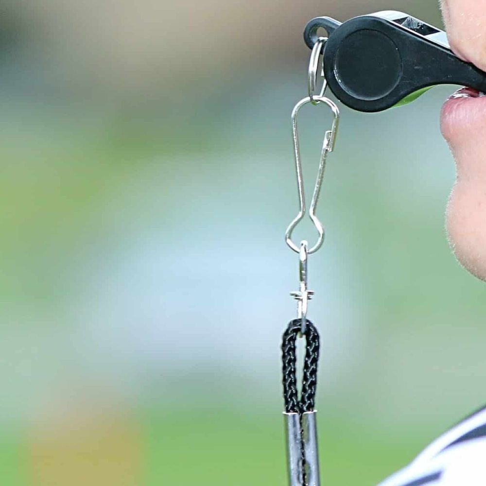 Minimalist image of young football referee.